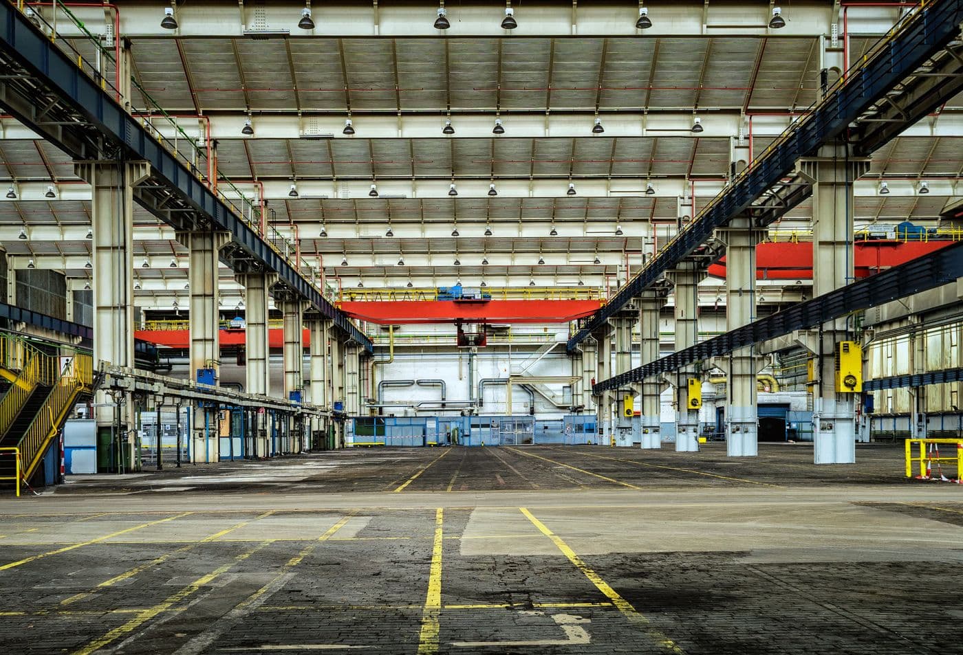 A quiet warehouse aisle, stripped to what the work needs