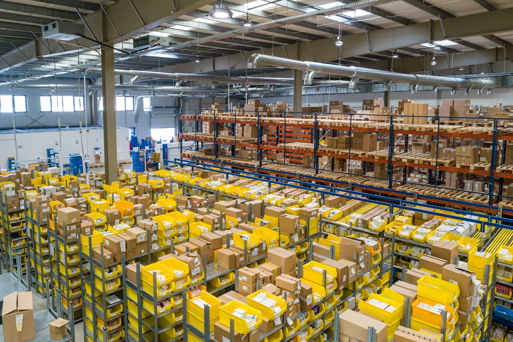 Stacked warehouse cartons in an industrial aisle